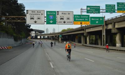 Bicycle riders traverse I-5 Express lanes.